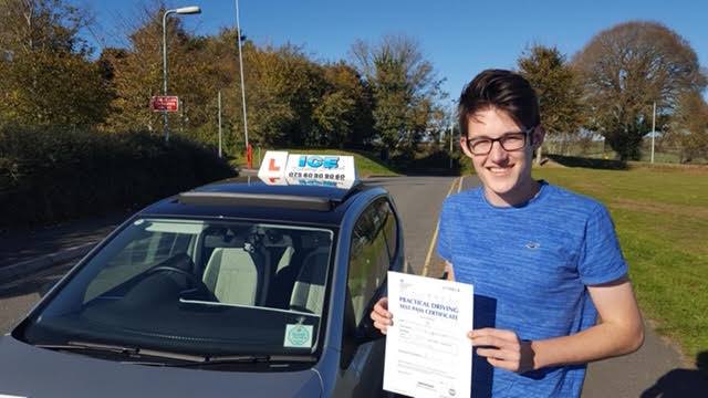 man in blue t shirt after passing driving test