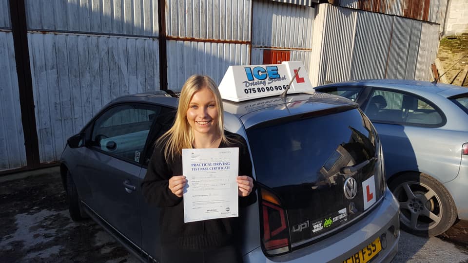 student next to volkwagen after newton abbot driving test