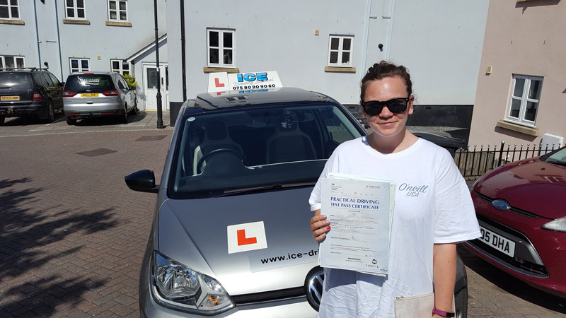 car and person with driving test certificate