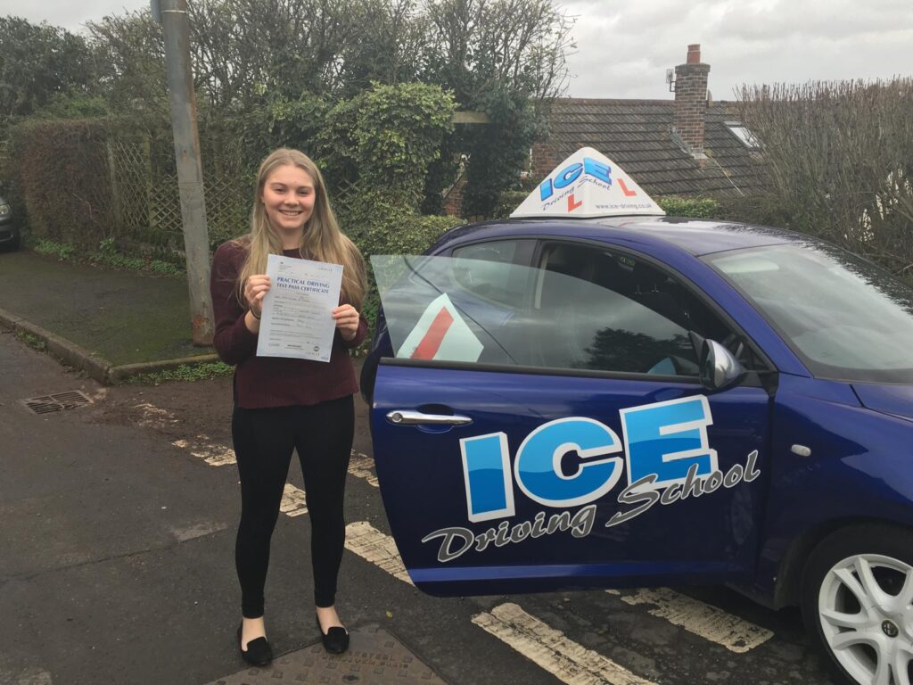 student next to car in newton abbot
