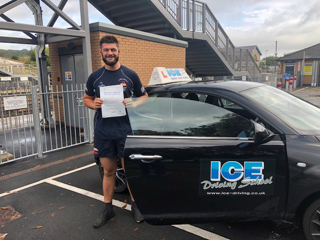 man at totnes train station after driving lesson in south devon